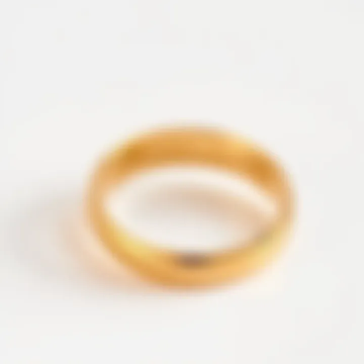 14 karat gold ring on a white background A shiny 14 karat gold ring displayed on a clean white surface showcasing its design and clarity