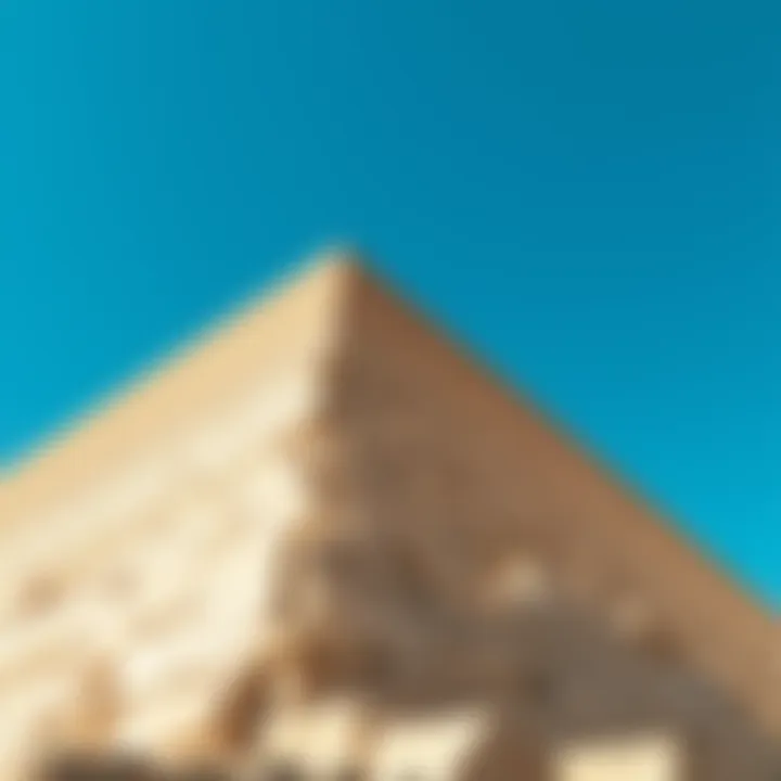 Ancient Pyramid Structure A close-up view of the Pyramid of Giza under a clear blue sky, showcasing its massive stone blocks and historical significance.