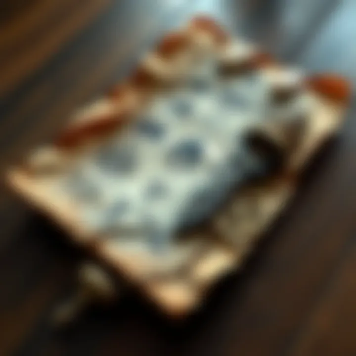 A close-up of an ancient scroll featuring symbols and illustrations related to Hermetic philosophy, placed on a wooden table.