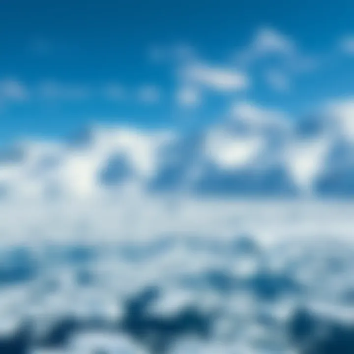 Wide view of Antarctica's icy terrain with snow-covered mountains and glaciers under a clear blue sky.