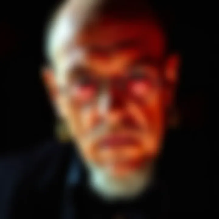 A close-up portrait of Anton LaVey with a serious expression, set against a dark background, highlighting his unique style and persona.