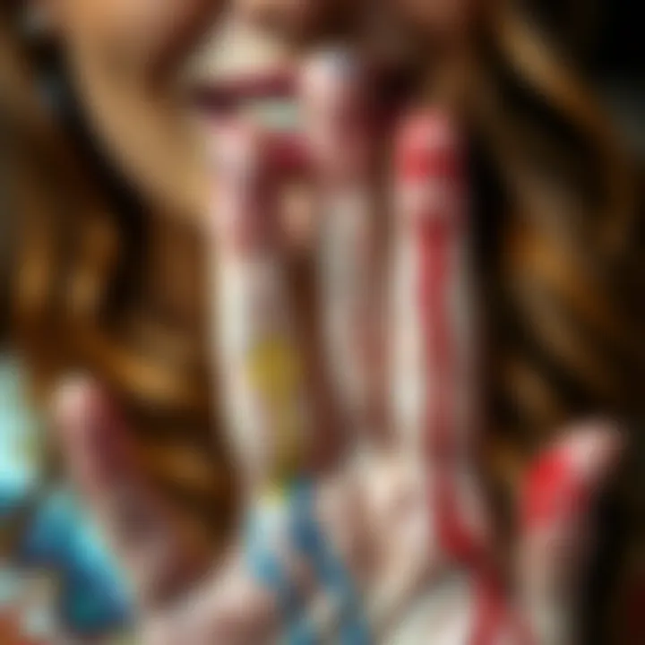 Art teacher showing her fingers with paint stains A close-up of an art teacher's fingers with paint stains resembling small cuts