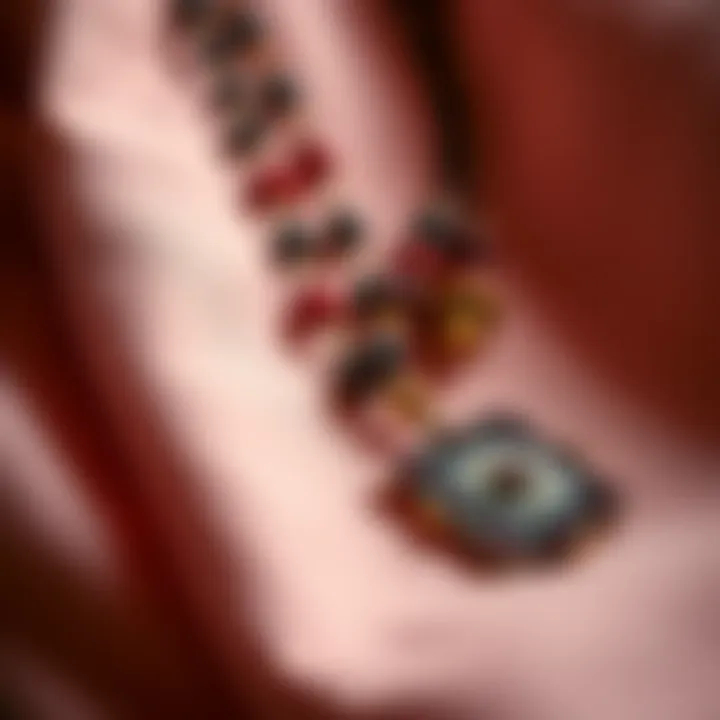 A close-up of a second hand Avalokitesvara necklace with intricate beads and a pendant, set against a soft fabric background.