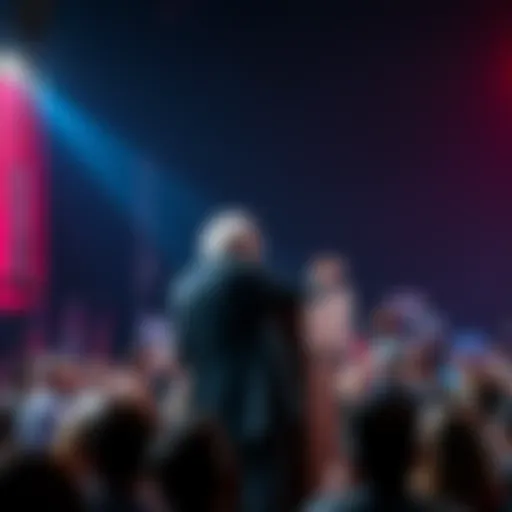 Bernie Sanders stands at a podium discussing the impact of machines on jobs, with a crowd listening attentively.