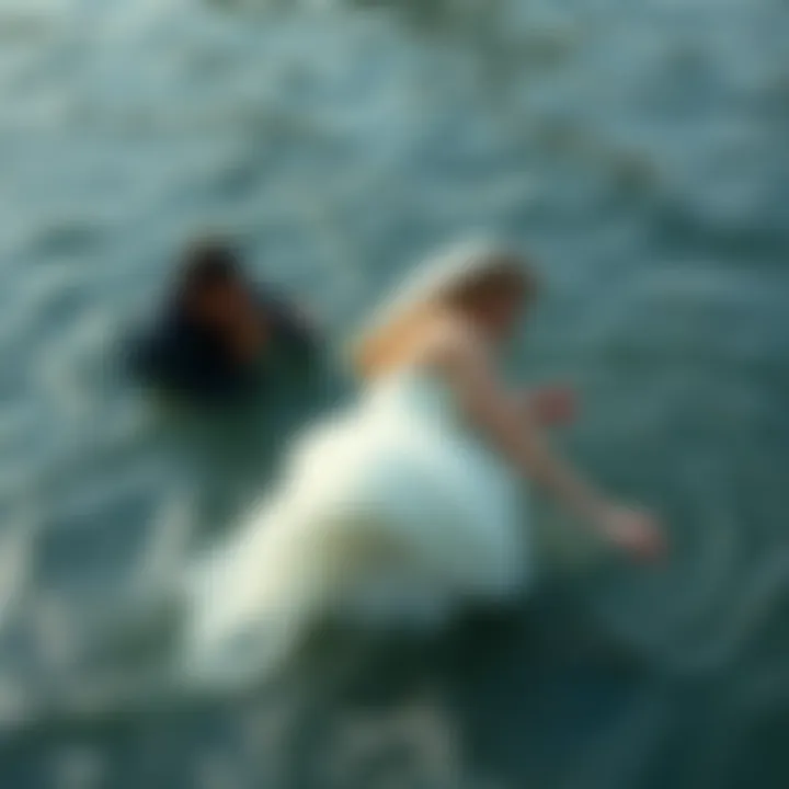 A bride struggling in deep water during a photo shoot, her dress heavy and soaked, while a photographer attempts to reach her