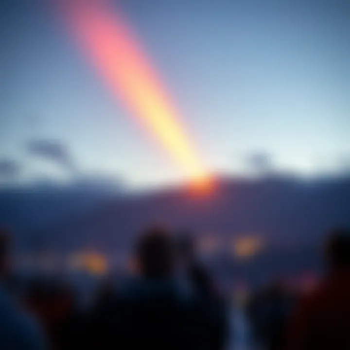 A bright orange object in the winter sky over Winter Park, Colorado, fading to white, with people watching and taking photos.