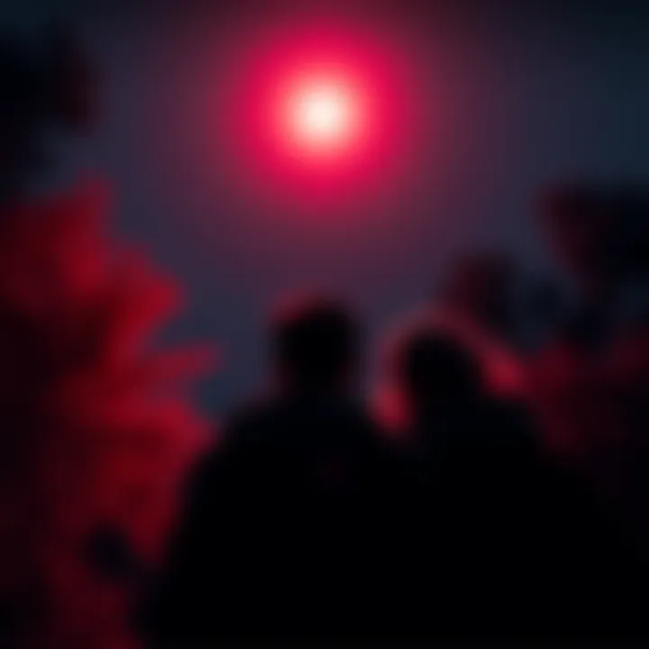 Two teenagers looking up at a bright red light in the night sky, surrounded by trees and an eerie atmosphere.