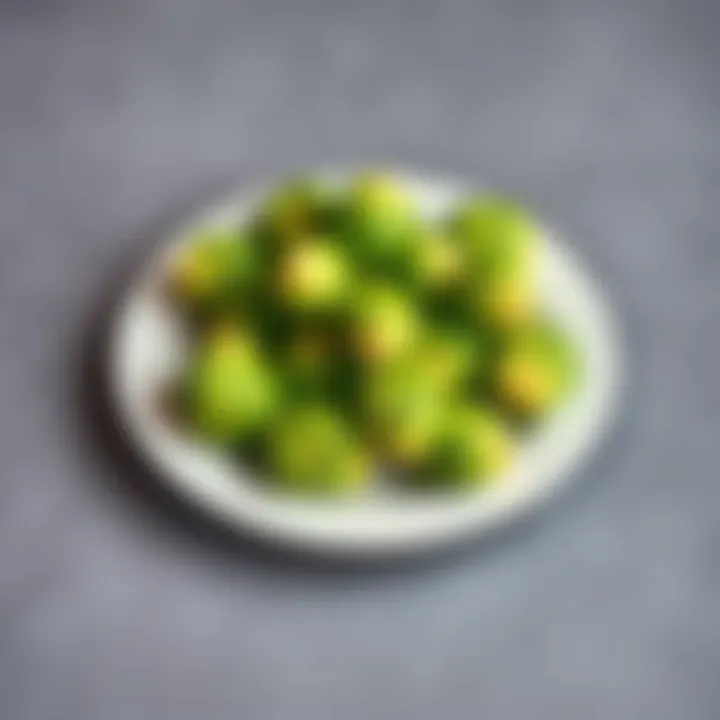 A close-up of fresh Brussels sprouts on a white plate, showcasing their green texture and shape.
