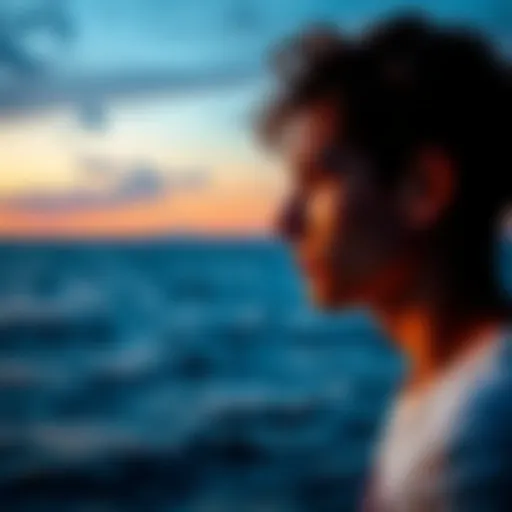 A person looking thoughtfully at the ocean, symbolizing the emotional depth of Cancer and Pisces traits.