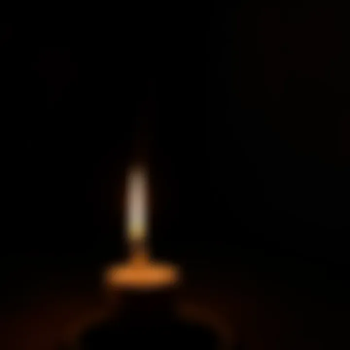 A lit candle in a dim setting, symbolizing a personal prayer to Apollo