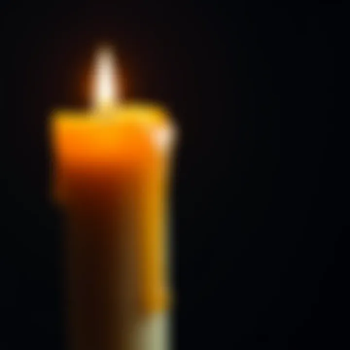 A lit candle with wax dripping down its side, showcasing the texture and flow of the melted wax.