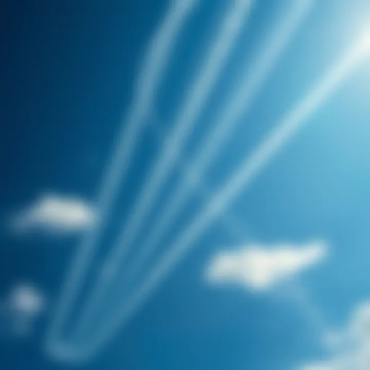 Long white streaks forming in the blue sky, resembling chemtrails, with a few clouds around.