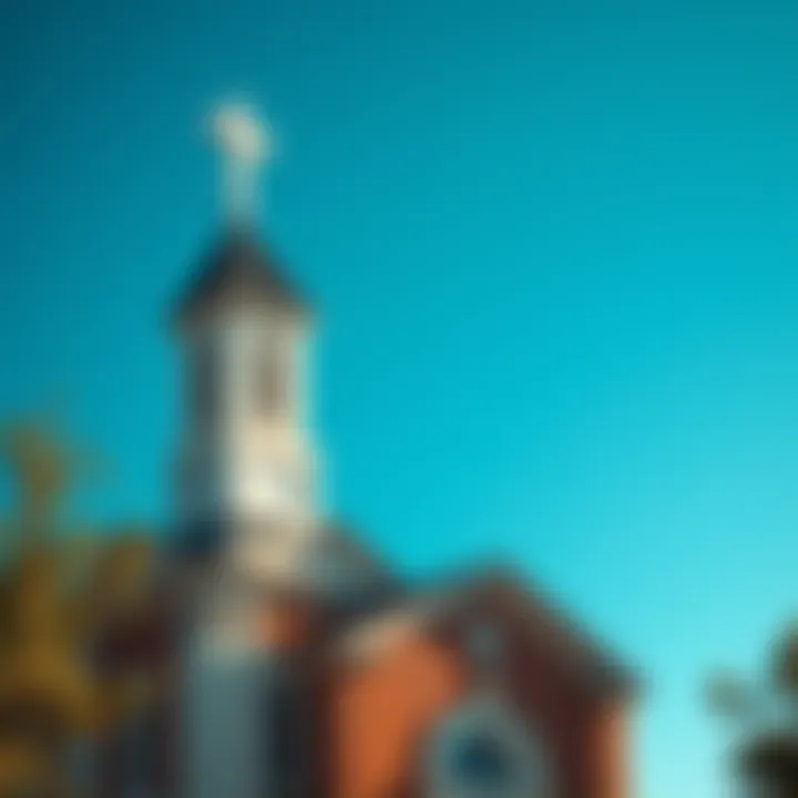 A traditional church building with a cross on top and a clear blue sky in the background.