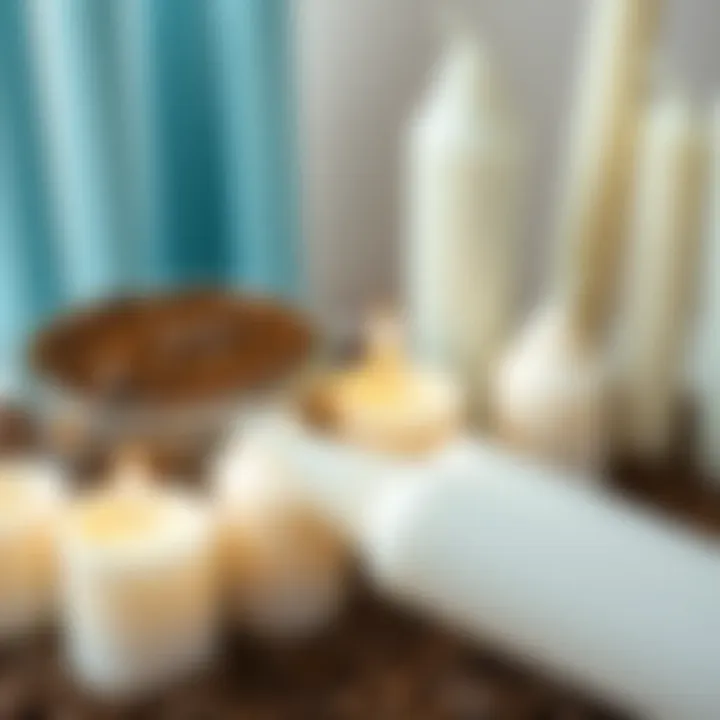 A display of light blue and cream white candles alongside a container of coffee grounds, showcasing alternative candle dressing methods.
