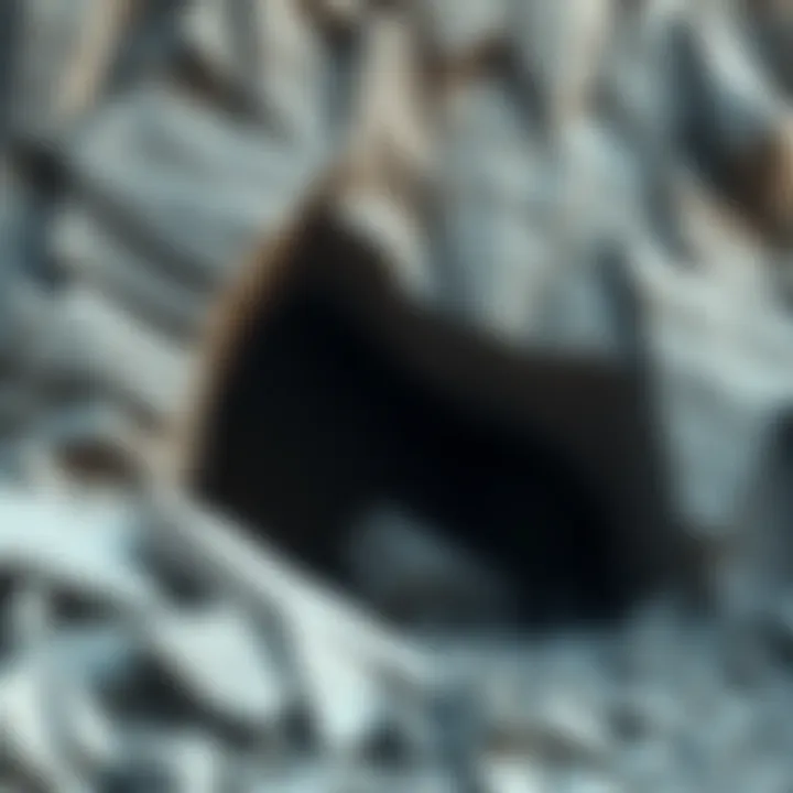 A view of a cliff face with loose boulders, showing a possible cave entrance peeking through the rocks.