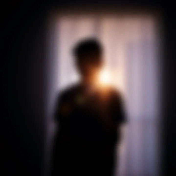 A person stands in a dimly lit room, holding a phone and looking worried, symbolizing concern over a friend's sudden silence.