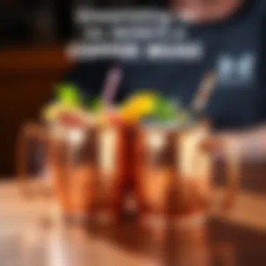 Two shiny copper mugs filled with colorful cocktails, garnished with lime and mint, sitting on a wooden table