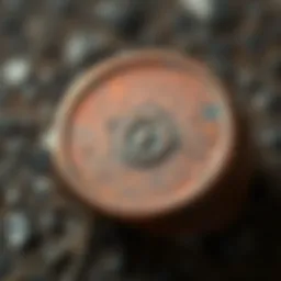 A close-up view of a copper ring featuring an unusual symbol etched on its surface, showing details of the design and metal texture.