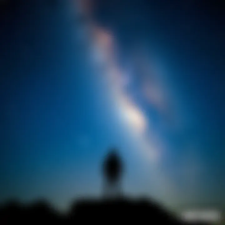 A silhouette of a person standing under a starry sky, symbolizing the connection between humans and the universe.