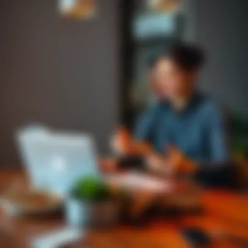 A man and woman sit at a table with laptops and wedding rings, discussing work and relationship goals.