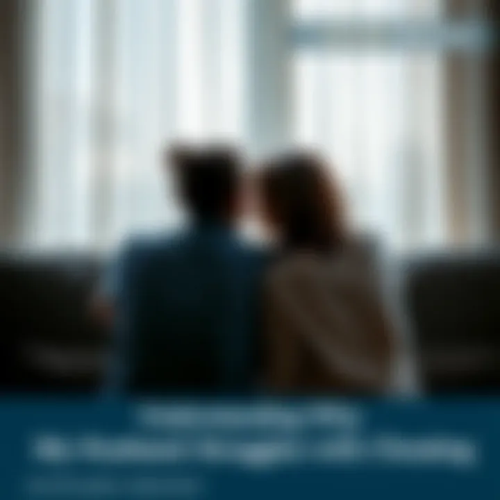 A couple sitting on a couch, looking away from each other in frustration, symbolizing tension and emotional distance in a relationship.