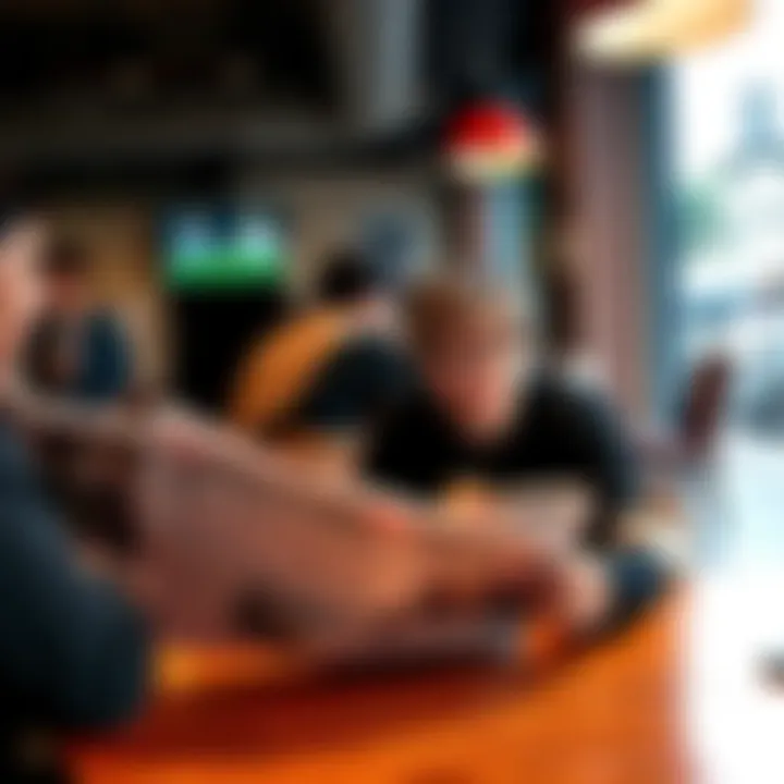 People discussing news articles in a cafe, showing a newspaper and a smartphone with news headlines