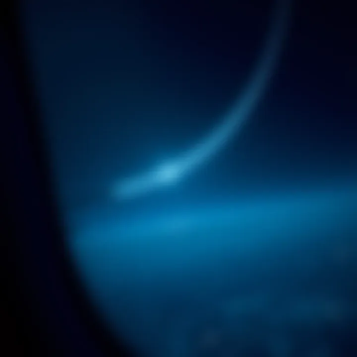 A series of bright white lights arranged in a curved line, seen in the night sky from an airplane window during a flight