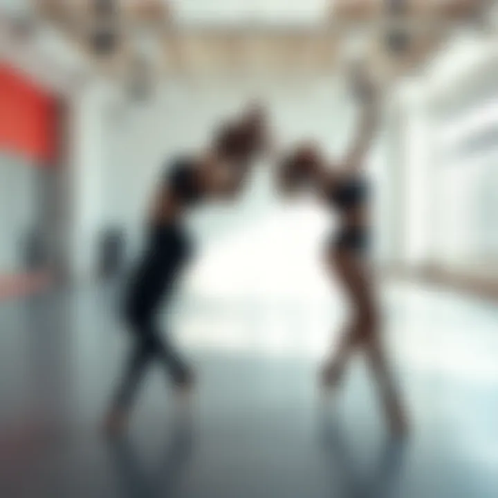 Two dancers illustrating the connection between left and right body forms in a dance studio.