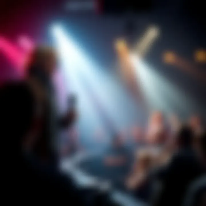 David Icke stands on stage addressing an audience, with a focused expression and a microphone in hand, surrounded by a crowd listening intently.