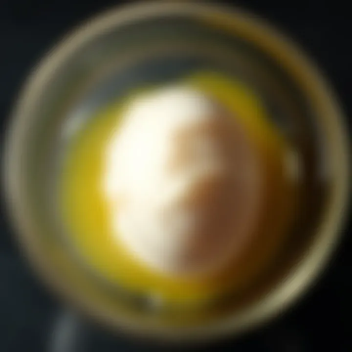 A cracked egg in a bowl showing cloudy patterns, symbolizing interpretations of egg cleansing experiences