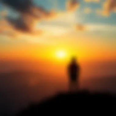 A person standing on a hill looking at a sunrise, symbolizing hope and resilience during tough times.
