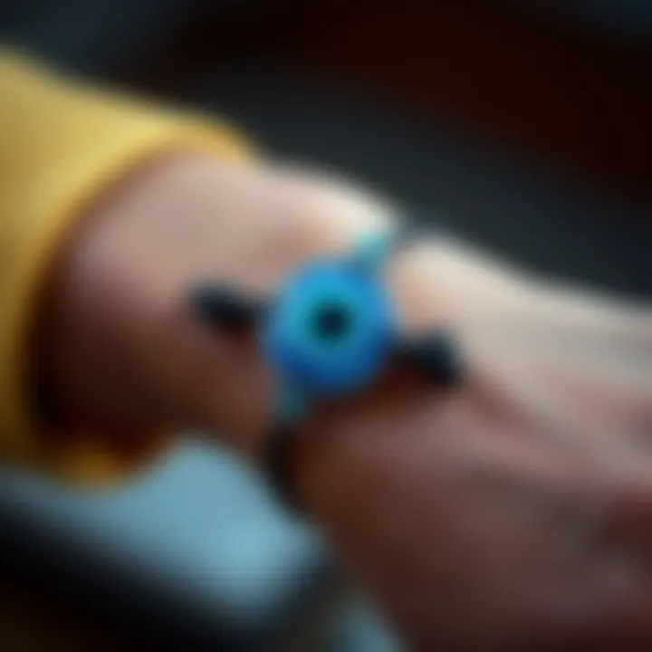 A close-up of an elastic evil eye bracelet worn on a person's wrist, showcasing its vibrant blue eye design and beads.