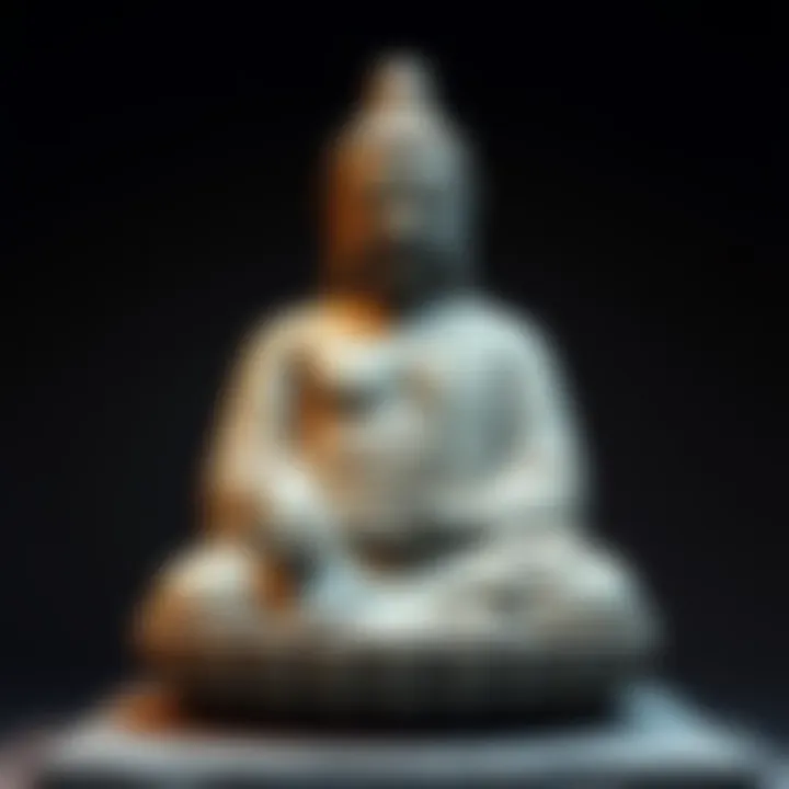 A grey schist sculpture of an emaciated Siddhartha, representing the Fasting Buddha from Gandhara art, highlighting themes of austerity and enlightenment.