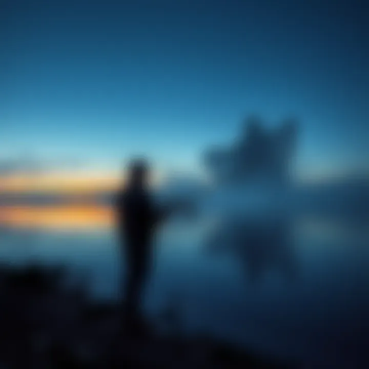 A fisherman standing on the shore of Lake Illawarra at dusk, looking out over the water with a misty silhouette of a ghostly figure in the background.
