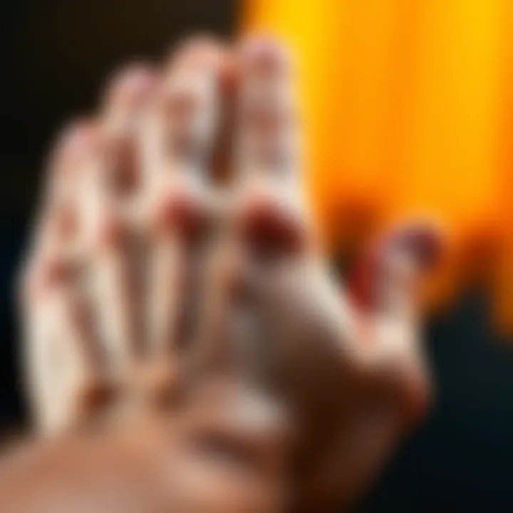 Close-up of a hand showing freckles on the palm with a warm background