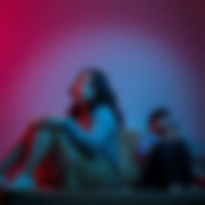 Two friends taking a break Two friends sitting apart, one looking thoughtful while the other is checking their phone, showing signs of needing space in a friendship.