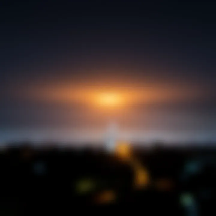A bright, glowing light seen in the night sky above a suburban area in SE Melbourne, illuminating the dark surroundings.