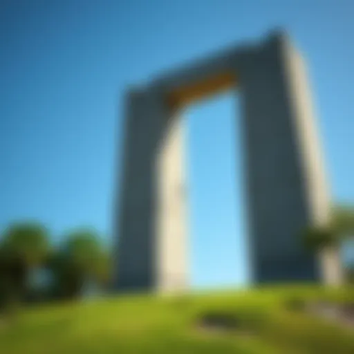 A large granite structure, possibly built by Templars, standing tall among lush greenery with a clear blue sky in the background.