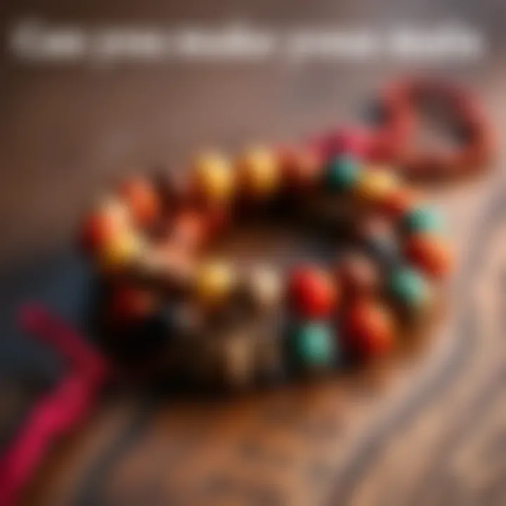 A close-up of a handmade japa mala made from colorful beads and natural materials, placed on a wooden surface.