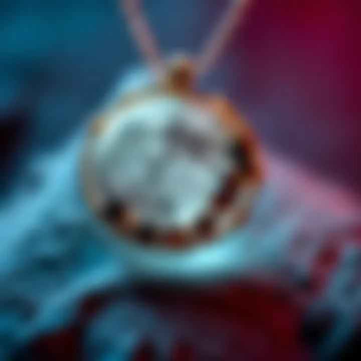 A close-up of a handmade moon pendant featuring garnet and wire, showcasing its intricate design and craftsmanship.