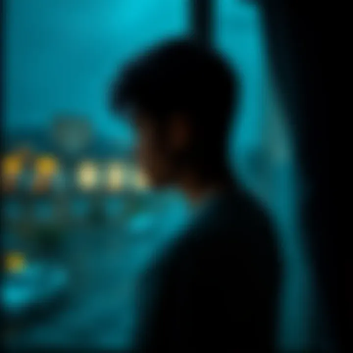 A person with a sad expression gazes out a rainy window, reflecting on heartbreak after infidelity