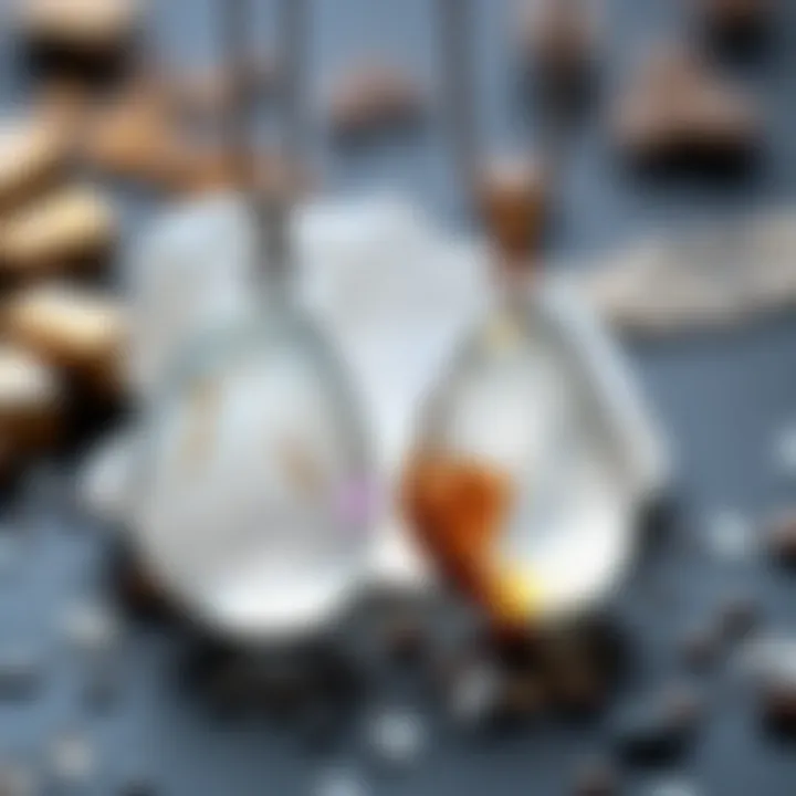 Two handcrafted Herkimer pendants with clear crystals on display