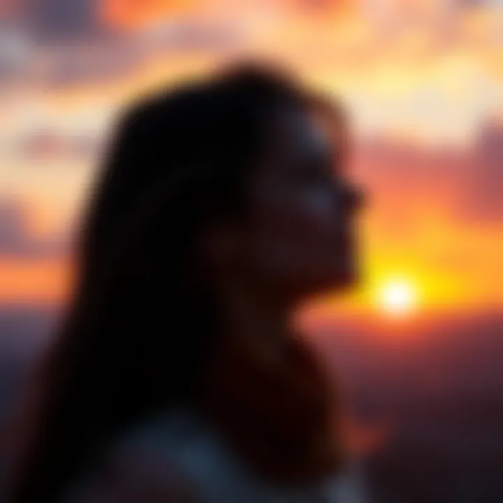A person looking hopeful while staring at a sunset, symbolizing hope in finding love after tough relationships.