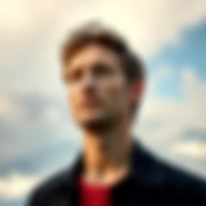 A scene from James Blunt's 'You're Beautiful' music video with a cloudy sky and a serene expression on his face, suggesting a moment of reflection.