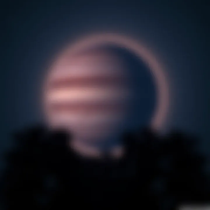 Jupiter in the night sky A bright, detailed view of Jupiter shining in the night sky above a silhouette of trees