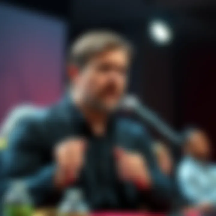 Kevin Smith speaking at a microphone during a film event, discussing his role in writing Good Will Hunting