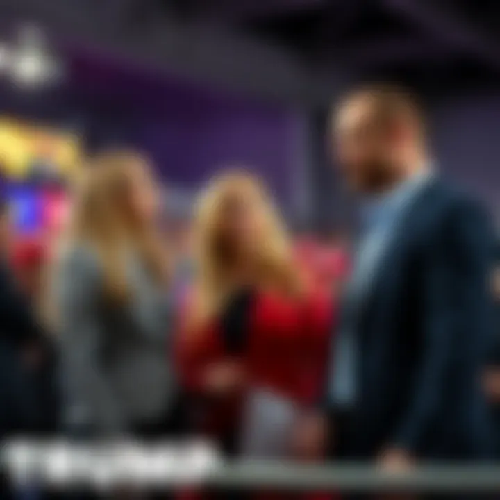 Erika Kirk, Lori Frantzve, and Tyler Boyer standing together at a Trump rally in Phoenix, looking engaged in conversation.