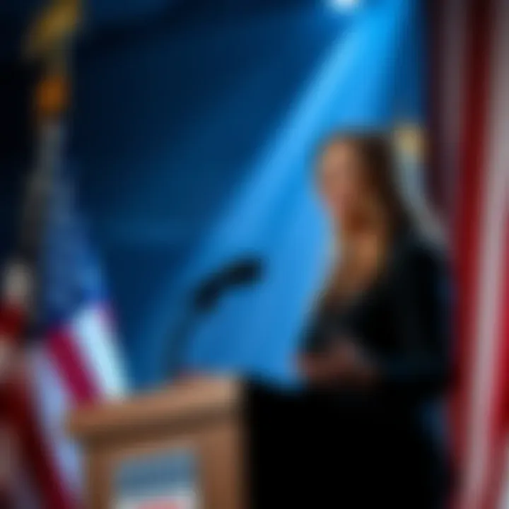 Laura Loomer Predicts Terror Attacks Laura Loomer speaking at a podium with a backdrop of the American flag, expressing her predictions about future terrorist events.