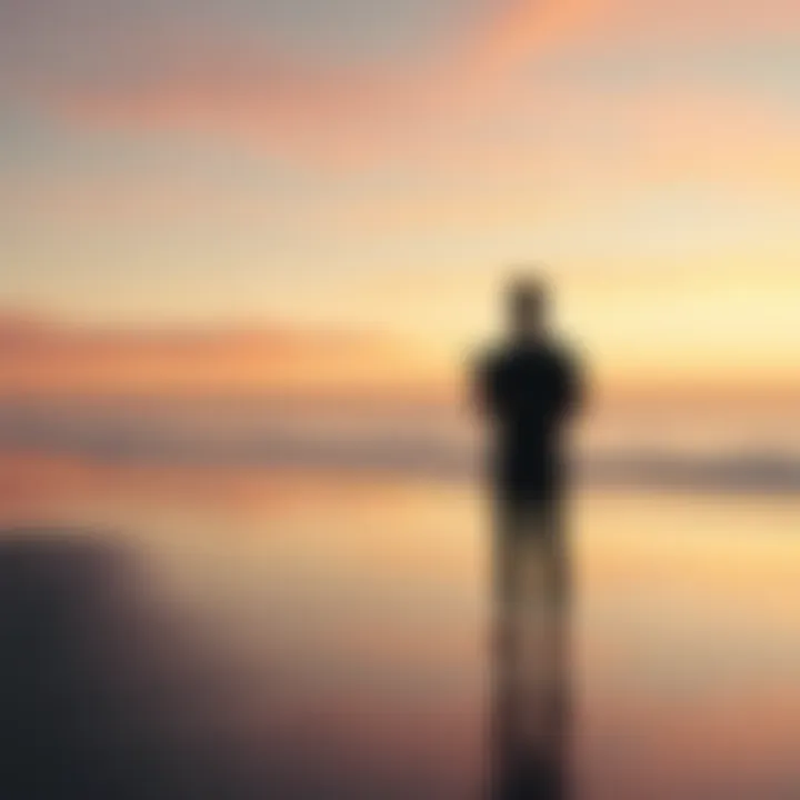 A person standing alone at a beach, looking towards the horizon while holding a phone, contemplating the decision to move on from a past relationship.