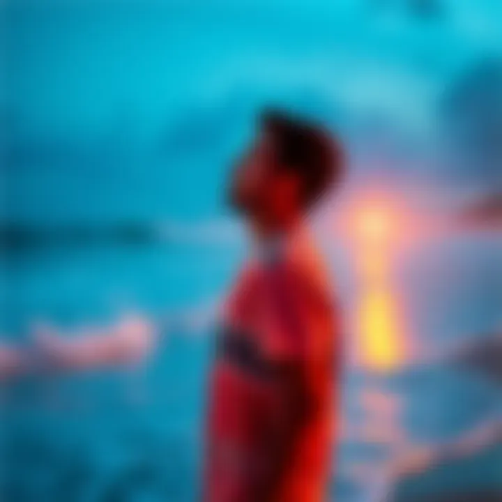A person standing on a beach in Mexico, looking thoughtful and contemplative, with waves in the background